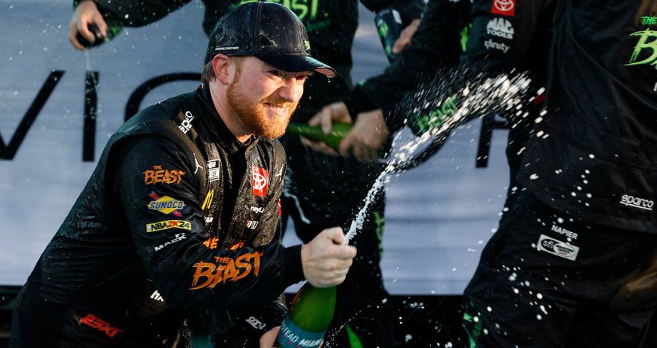 Tyler Reddick sprays victory champagne at Homestead-Miami Speedway.