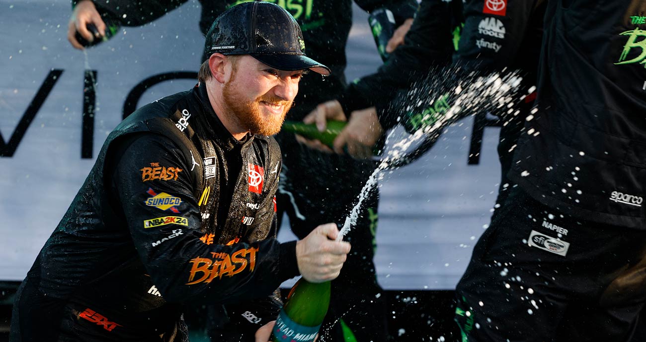 Tyler Reddick sprays victory champagne at Homestead-Miami Speedway.