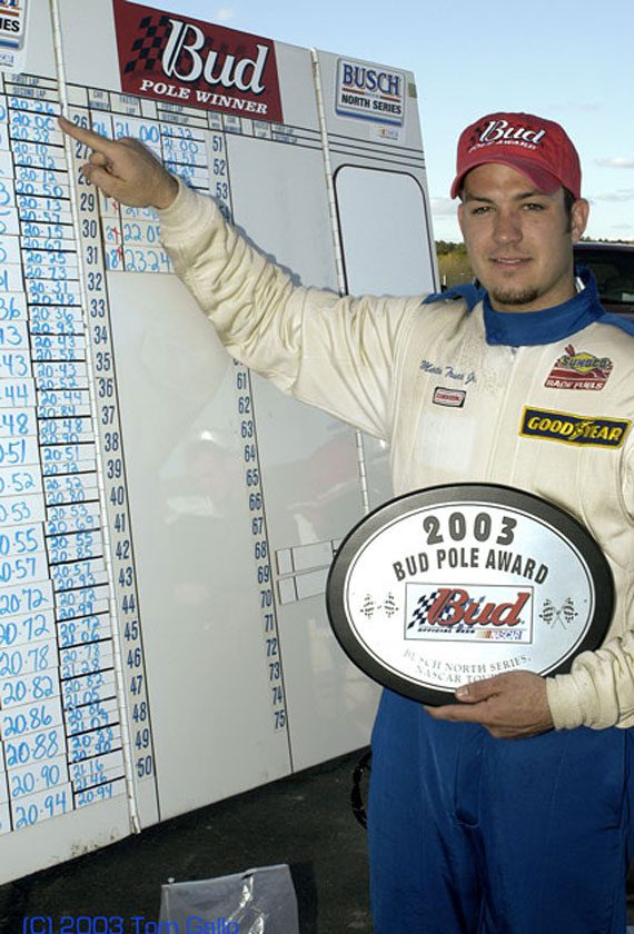 Martin Truex Jr. near the pole board at Stafford Motor Speedway in the former NASCAR Busch North Series. 