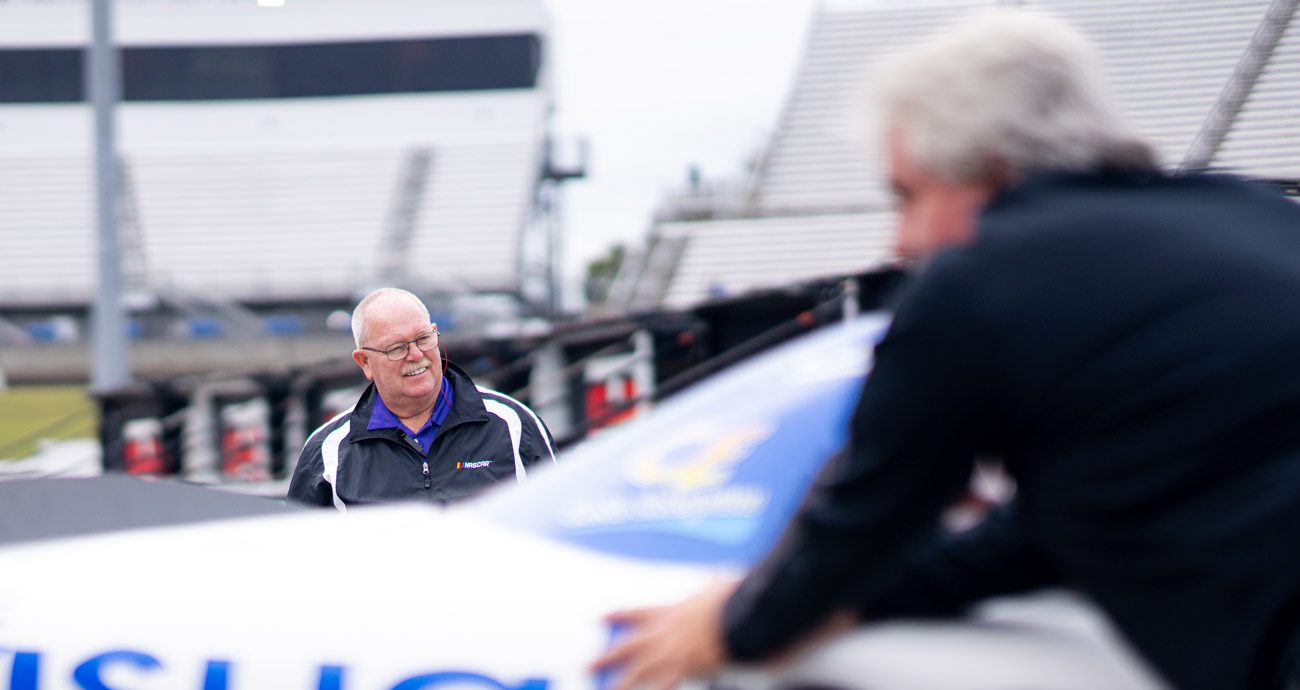 Wayne Auton smiles as a vehicle rolls through the NASCAR Xfinity Series garage at Martinsville.