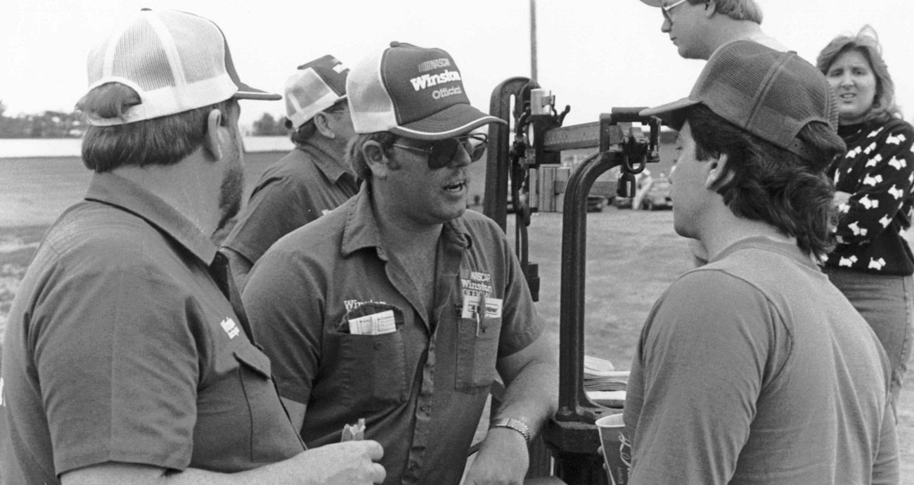 Wayne Auton, middle, officiates at a local track.