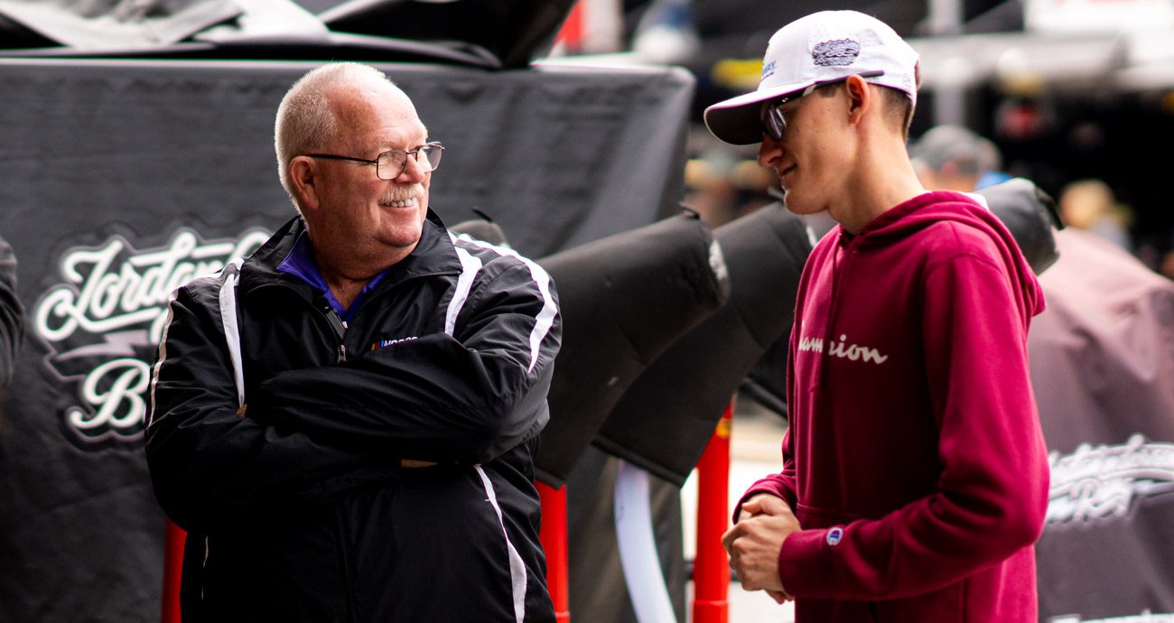 Wayne Auton smiles and speaks with Parker Retzlaff in the NASCAR Xfinity Series garage at Martinsville.