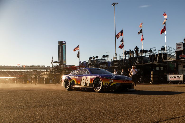 jimmie johnson drives out of garage