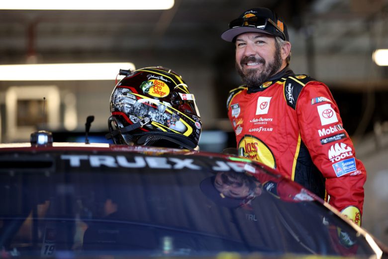 truex climbs in his car