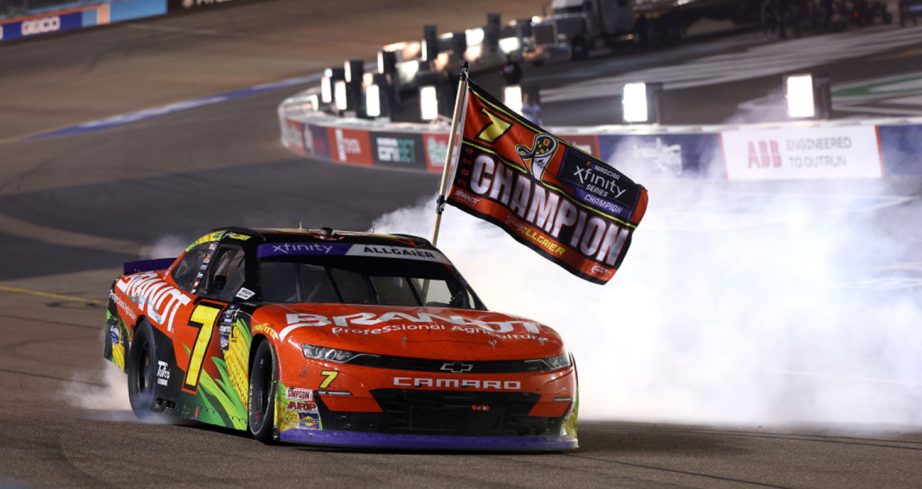 allgaier does a burnout with the championship flag