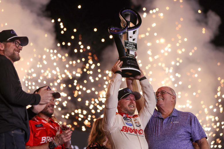 allgaier hoists the trophy