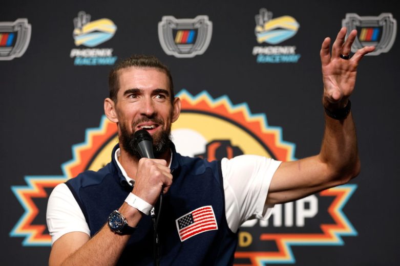 Michael Phelps speaks to the media at Phoenix Raceway.