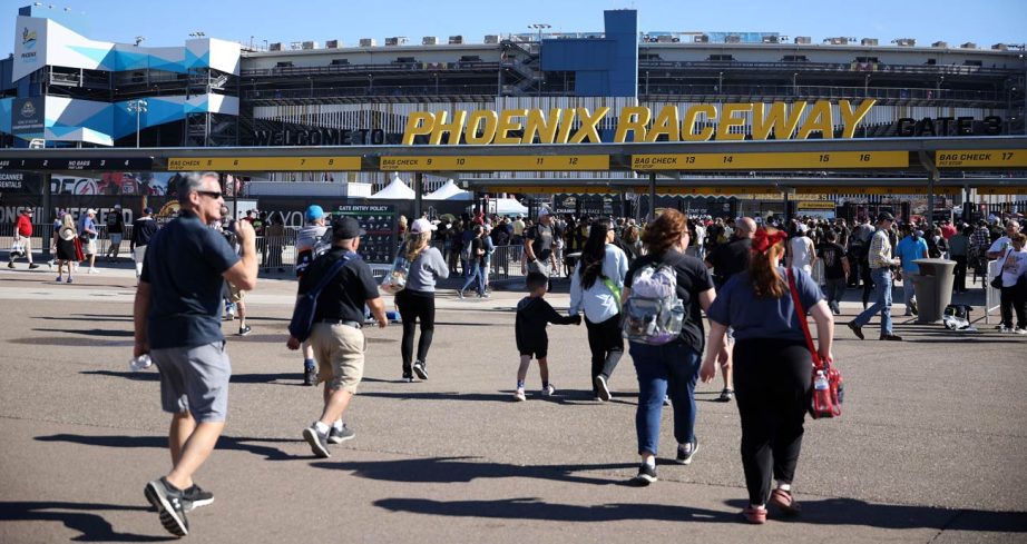 Fans walk to the entrance of Phoenix Raceway.