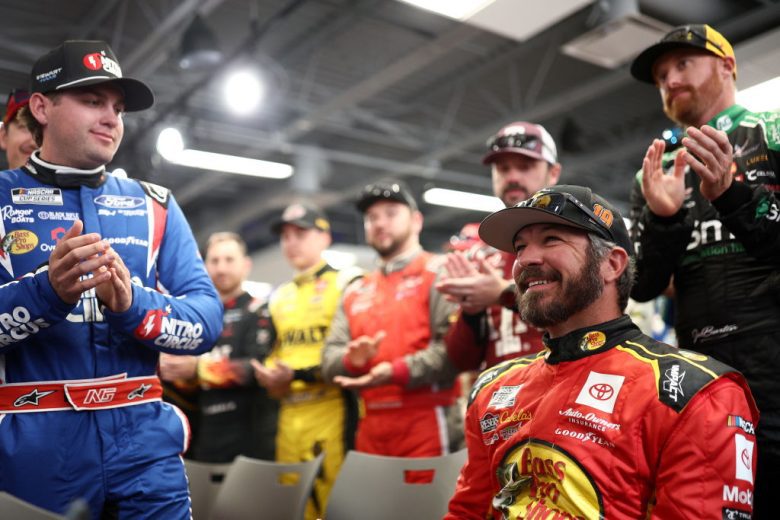 Drivers applaud Martin Truex Jr. at Phoenix Raceway.