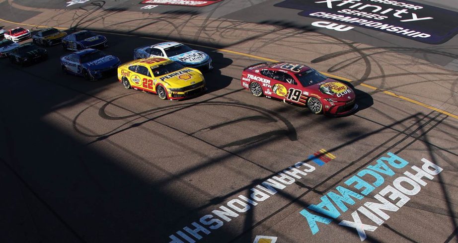NASCAR Cup Series cars race to the green at Phoenix Raceway.
