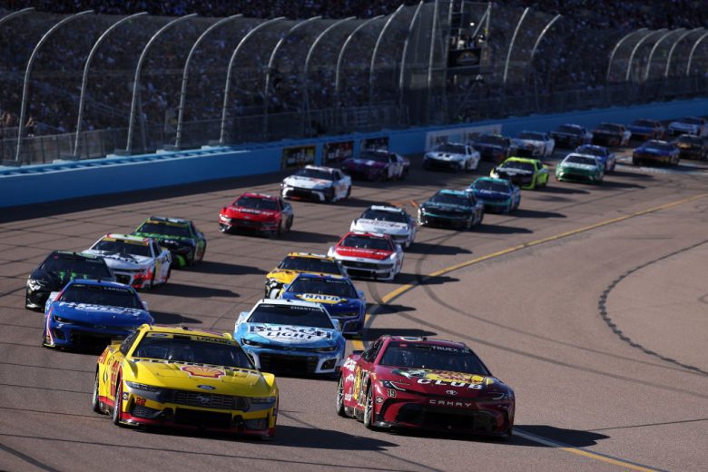NASCAR Cup Series cars race at Phoenix Raceway.