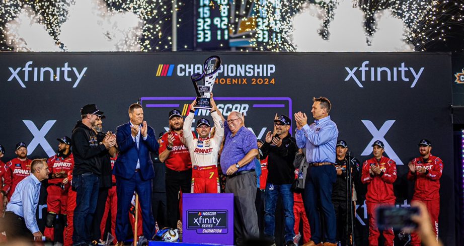 allgaier hoists the championship trophy