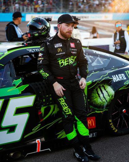Tyler Reddick leans on his No. 45 Toyota.