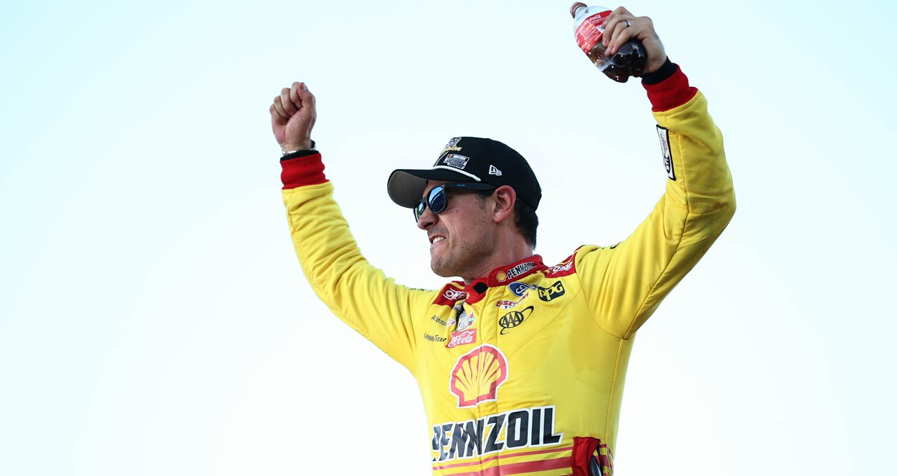 Joey Logano celebrates.