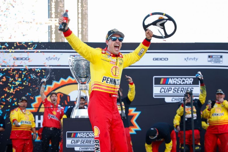 Joey Logano celebrates in Victory Lane