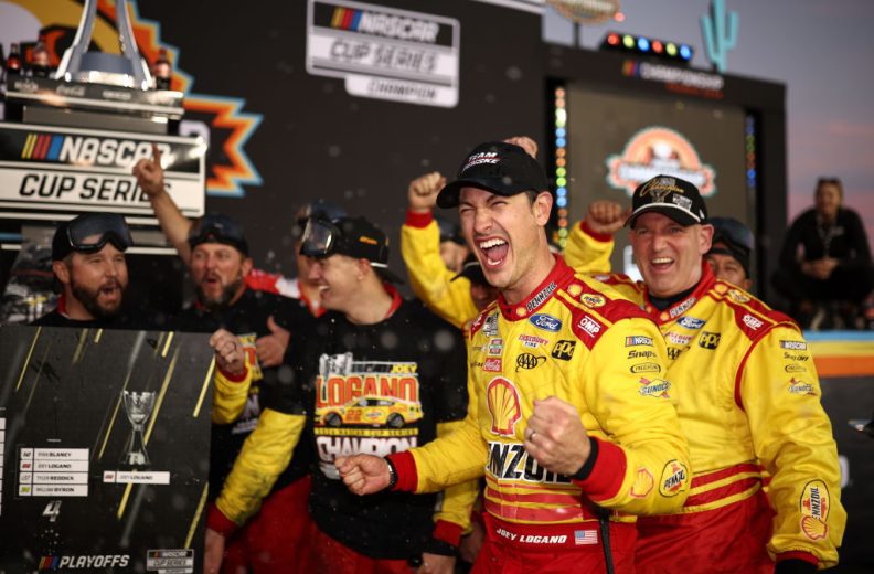 Joey Logano celebrates in Victory Lane.