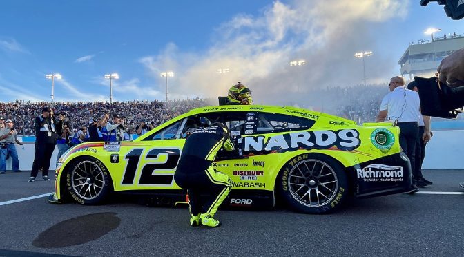 ryan blaney next to his car