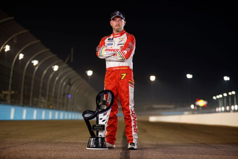 Justin Allgaier poses with the championship trophy.