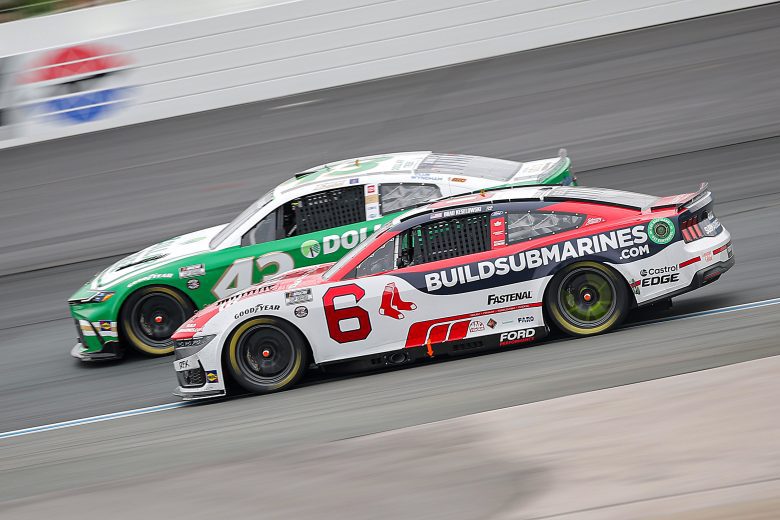 Brad Keselowski, driver of the No. 6 BuildSubmarines.com Ford, and Erik Jones, driver of the No. 43 Dollar Tree Toyota, race during the NASCAR Cup Series USA Today 301