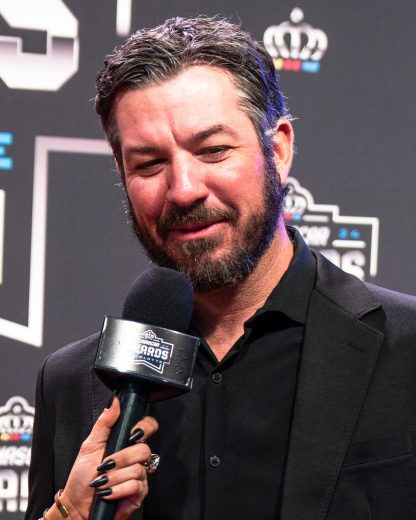 Martin Truex Jr. gives an interview on the red carpet.