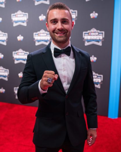 Ty Majeski poses for a photo on the red carpet.