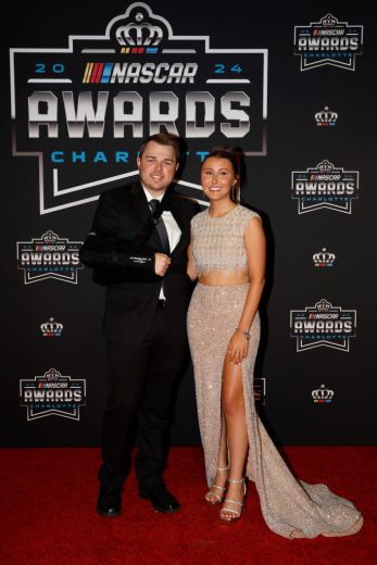 Layne Riggs (L) poses for a photo on the red carpet.