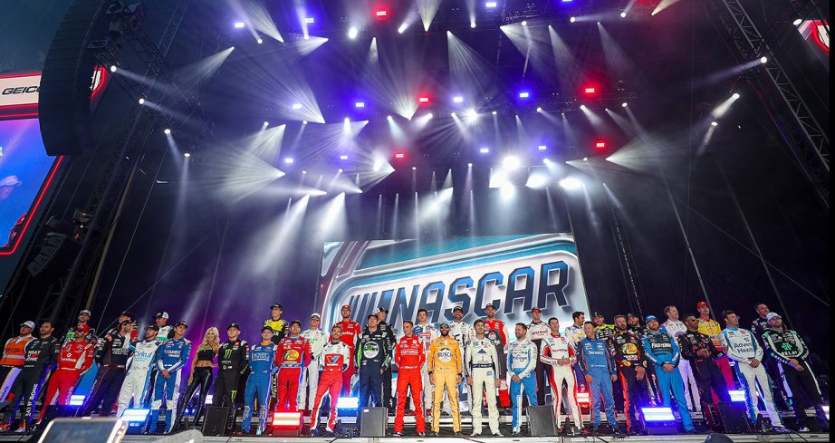 NASCAR Cup Series drivers line the stage.