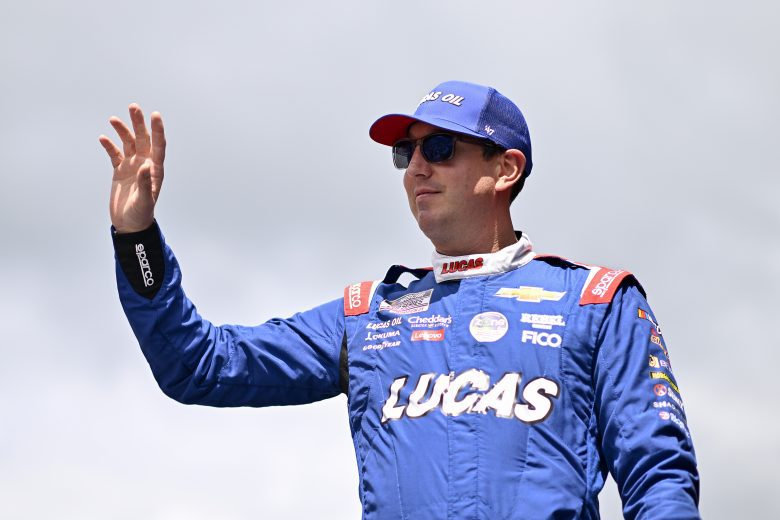 Kyle Busch, driver of the No. 8 Lucas Oil Chevrolet, waves to fans as he walks onstage during driver intros before the NASCAR Cup Series FireKeepers Casino 400 at Michigan International Speedway on August 18, 2024 in Brooklyn, Michigan.