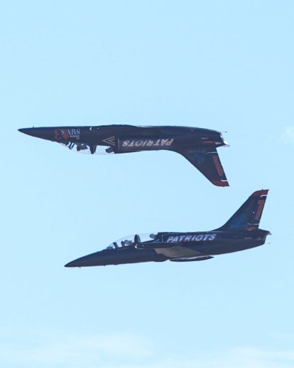 The Patriots Jet Team does a maneuver during a pre-race ceremony at Sonoma Raceway.