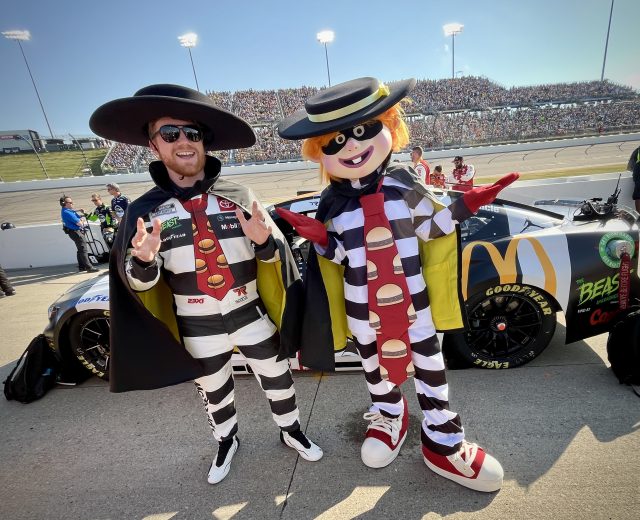 Tyler Reddick (L) poses for a photo with the Hamburglar (R) at Iowa Speedway.