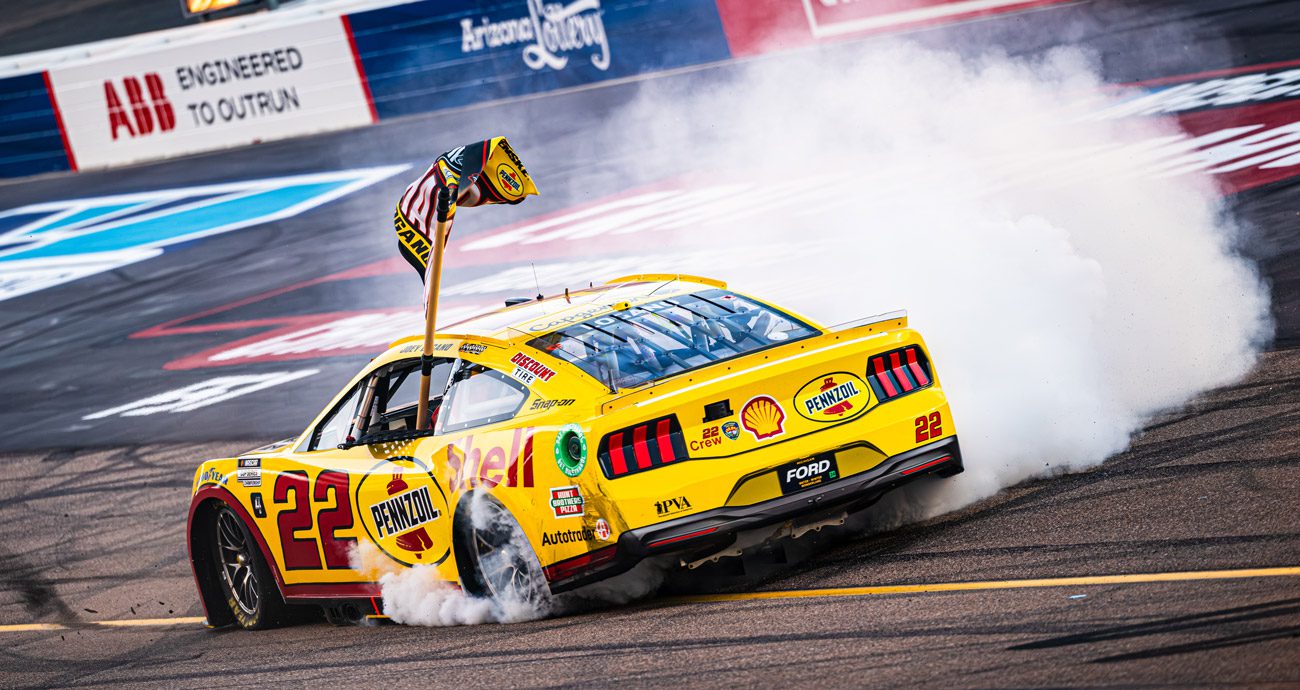 Joey Logano performs a burnout after winning the 2024 NASCAR Cup Series championship.