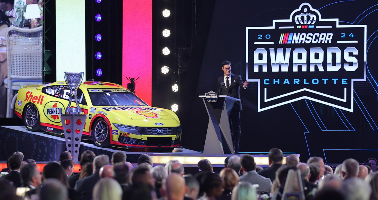 Joey Logano delivers a speech at the 2024 NASCAR Awards.