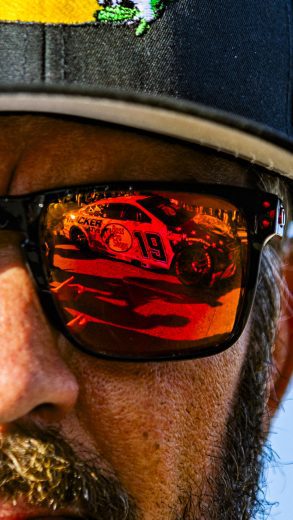 A close-up look at Martin Truex Jr.'s sunglasses with the reflection of the No. 19 Joe Gibbs Racing Toyota.