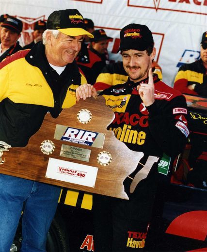 Davey Allison celebrates in Victory Lane at Richmond.