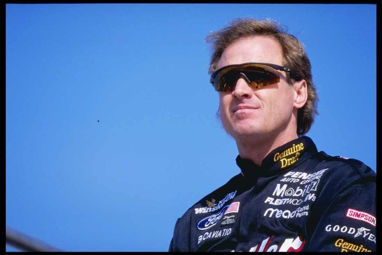 Rusty Wallace looks on.