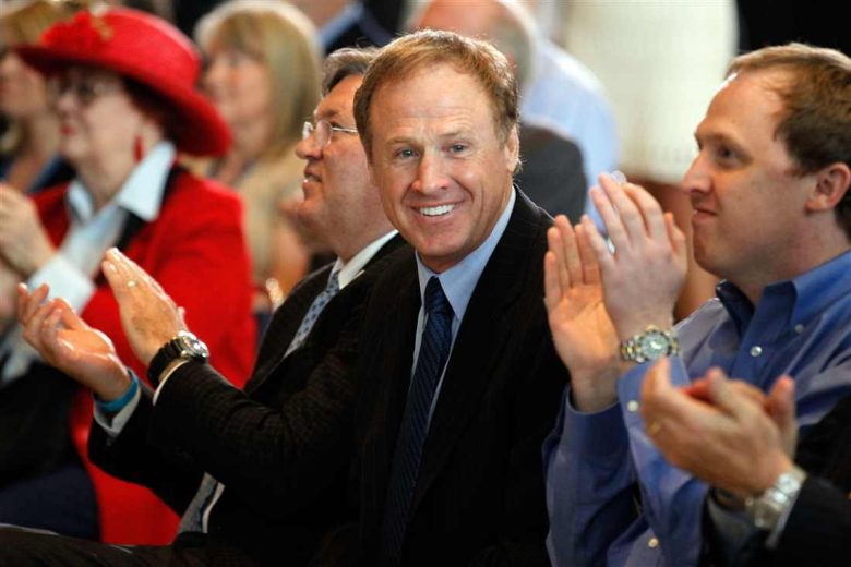 Rusty Wallace looks on.