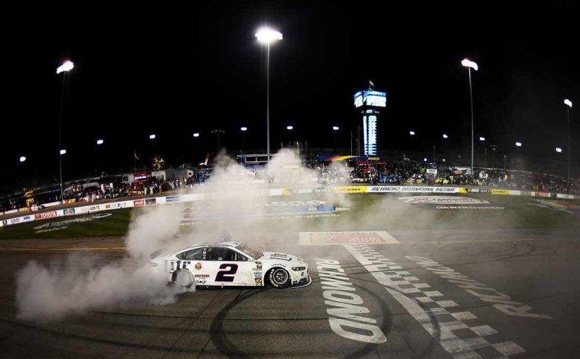 Brad Keselowski does a burnout after winning at Richmond.