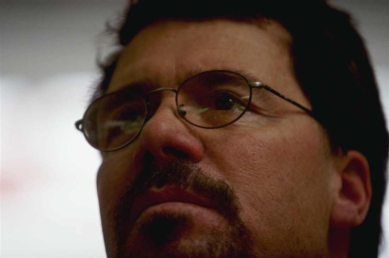 Ernie Irvan looks on.