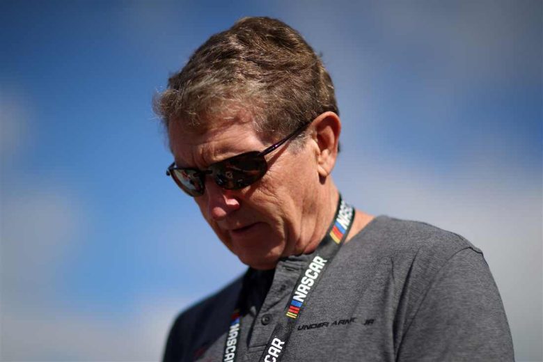 Bill Elliott looks on.
