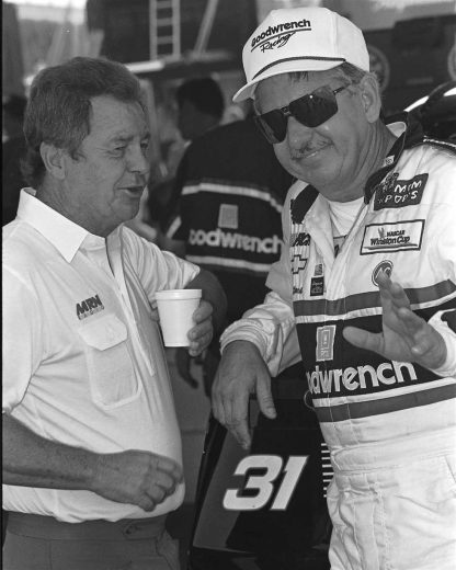 Neil Bonnett looks on.