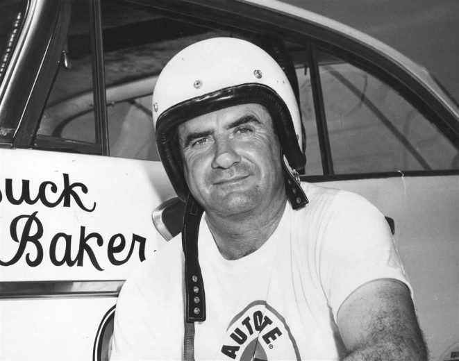 Buck Baker looks on.