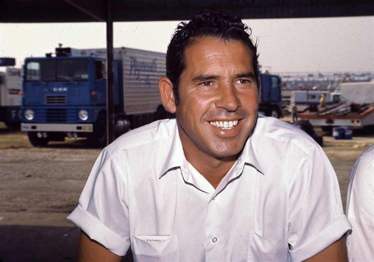 David Pearson looks on.