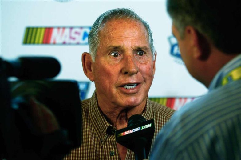 David Pearson looks on.