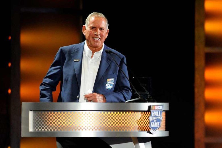 David Pearson looks on.