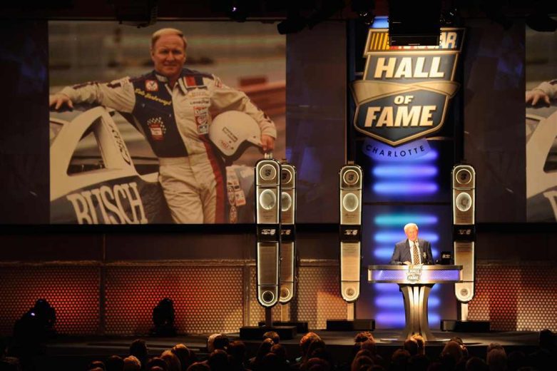 Cale Yarborough looks on.