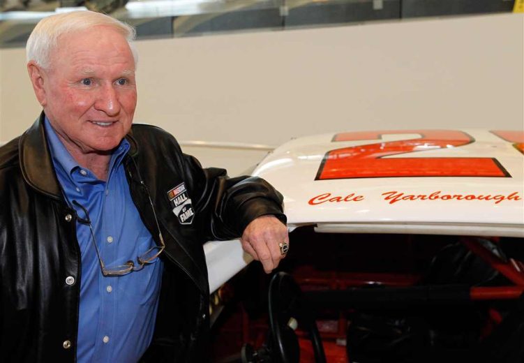 Cale Yarborough looks on.