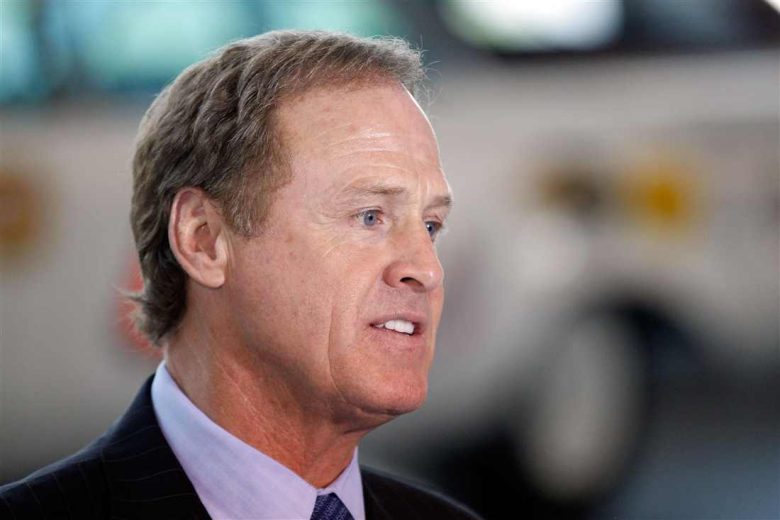 Rusty Wallace looks on.