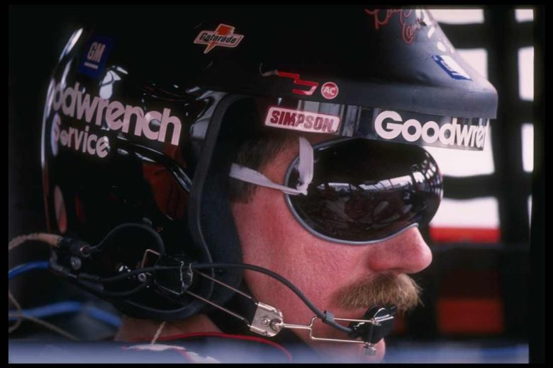 Dale Earnhardt sits in his car.