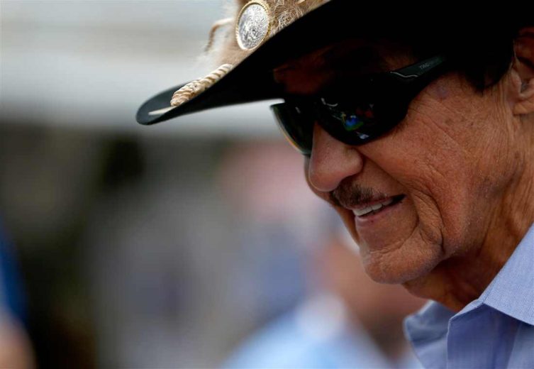 Richard Petty looks on.