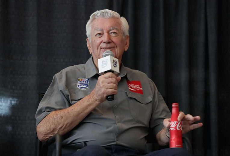 Bobby Allison looks on.